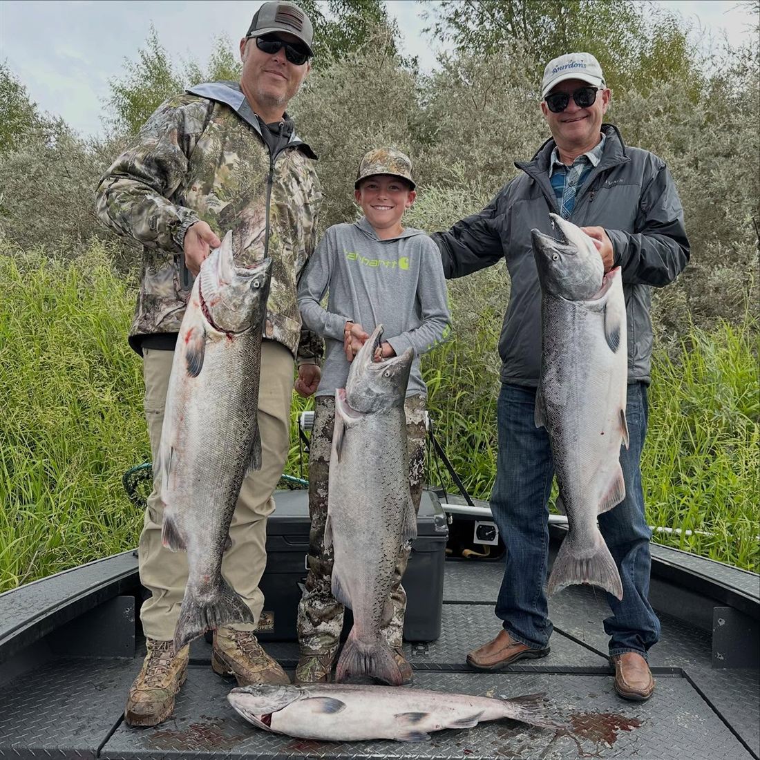 Three anglers with fresh King salmon
